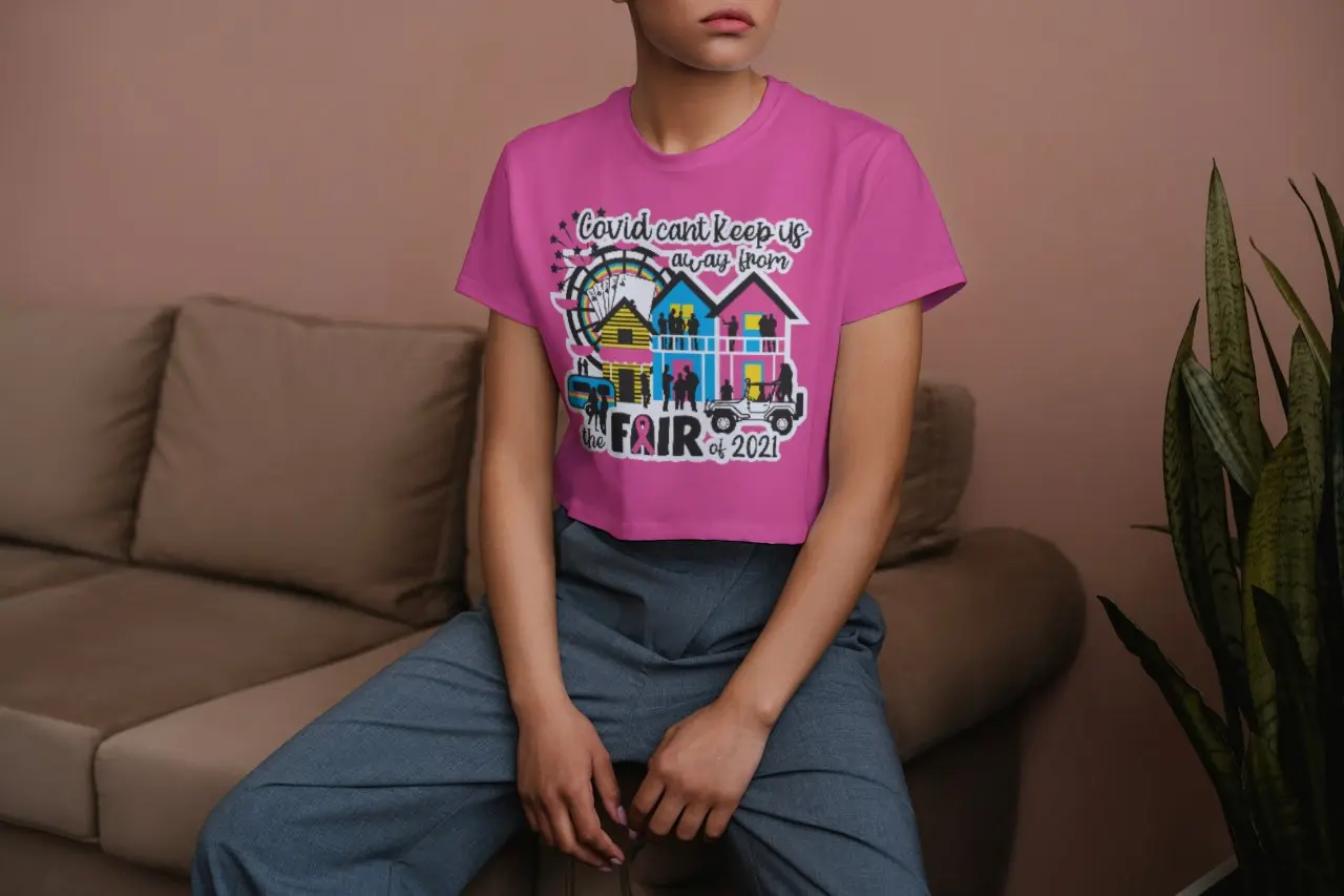 Girl sitting down while wearing a cropped NCF shirt